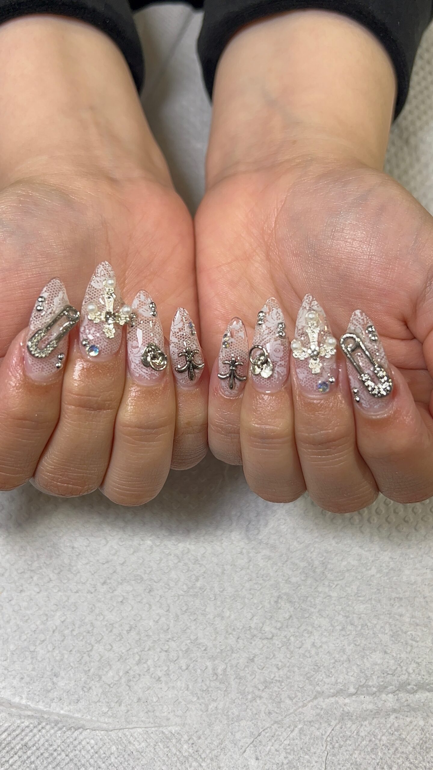 Long almond Gel-X nails with lace, charms and rhinestone nail art at SR Studio